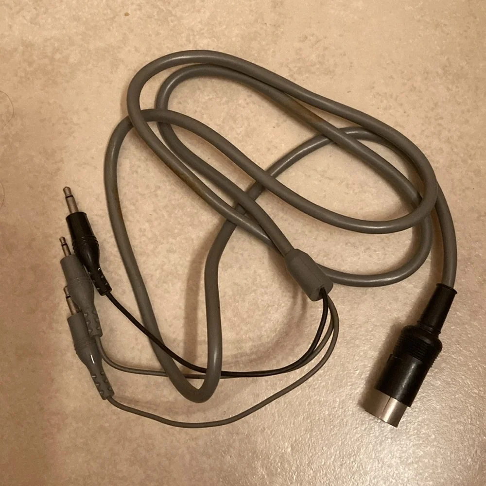 Radio Shack TRS-80 joysticks, game cable, game cartridge and Color Basic manual